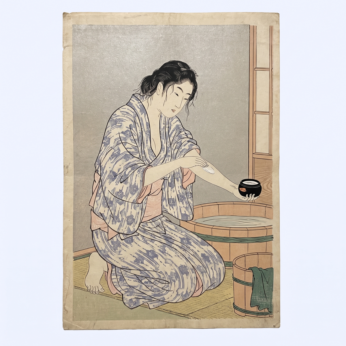 Ukiyo-e style illustration of a woman smoothing ointment onto her arm after a bath